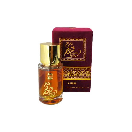 A bottle of Ajmal Eau de Parfum with a gold cap next to its dark red and gold box, on a plain white background.