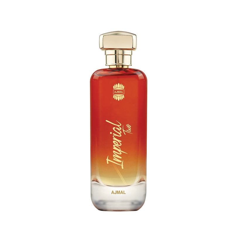 A bottle of Ajmal Imperial Two perfume with a red-to-gold gradient glass body and a gold cap, shown on a plain white background.